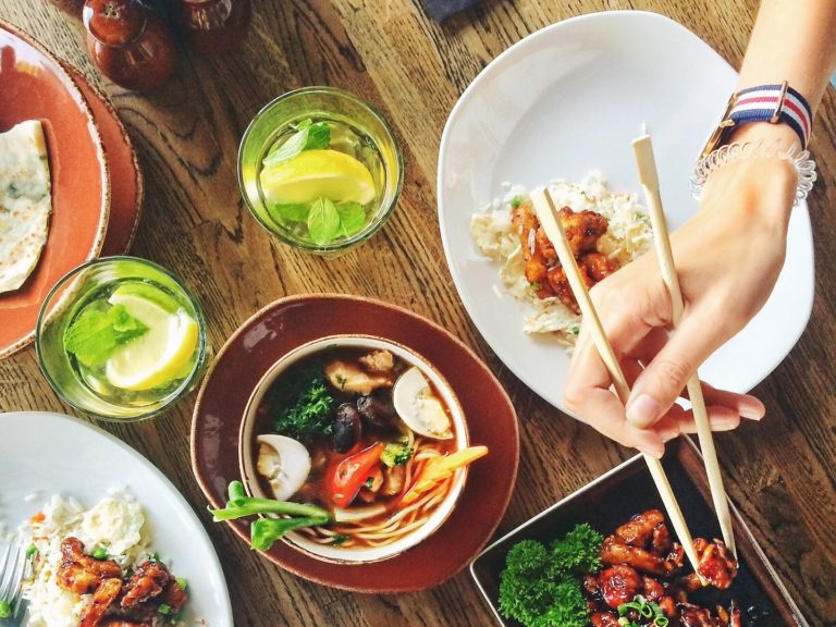 Sustainable Menu - E.Mission Person Eating with Chopsticks